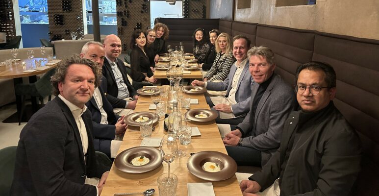 A group of people at dinner in a restaurant